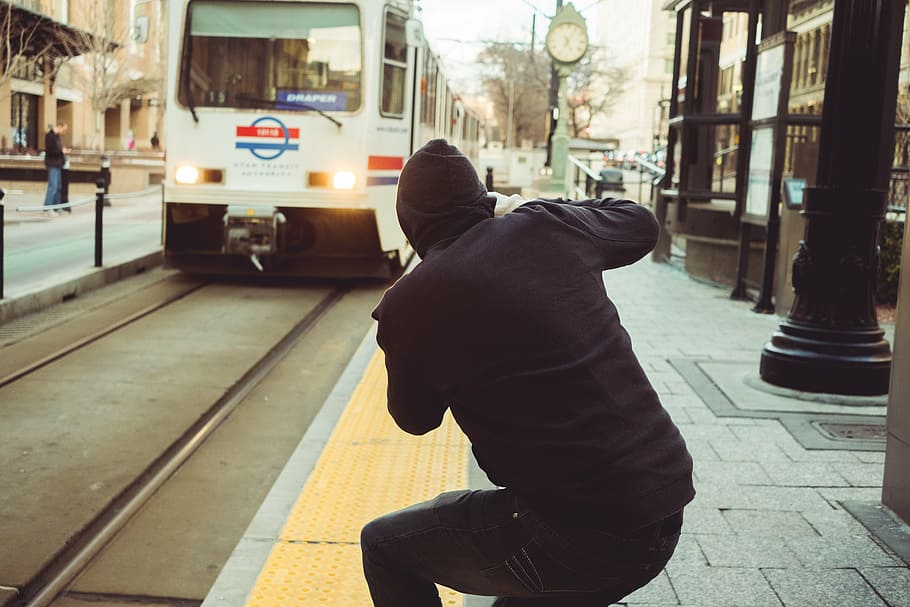 man standing near white train, people, black, trail, vehicle HD wallpaper