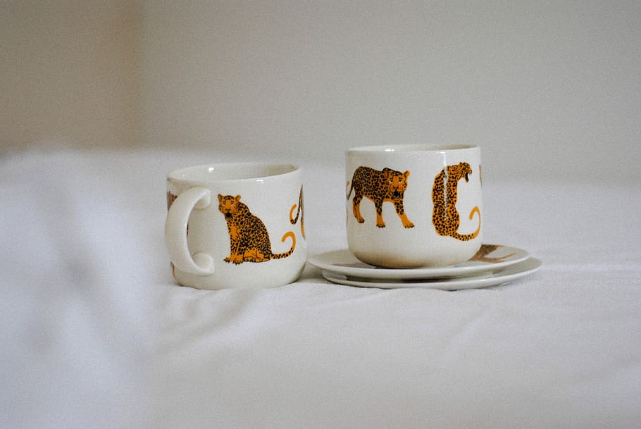 two white-and-brown ceramic cups with saucers, two white ceramic teacups with saucers HD wallpaper