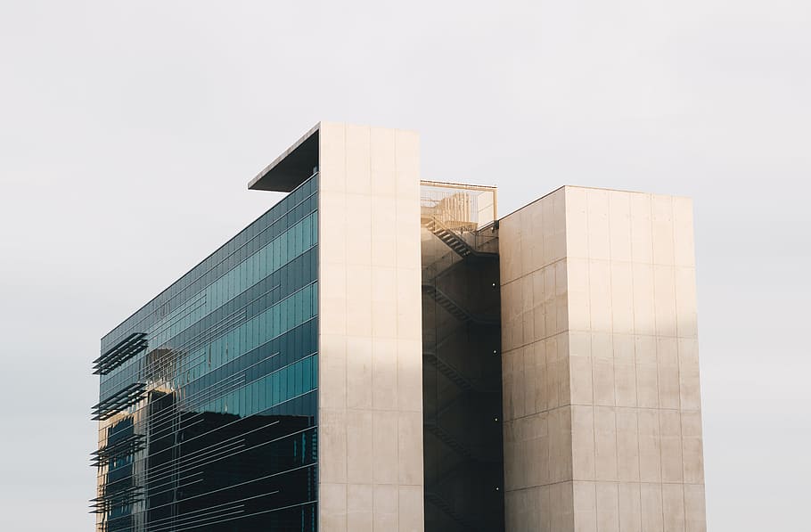 glass wall high rise building at daytime, white and black concrete building during daytime HD wallpaper