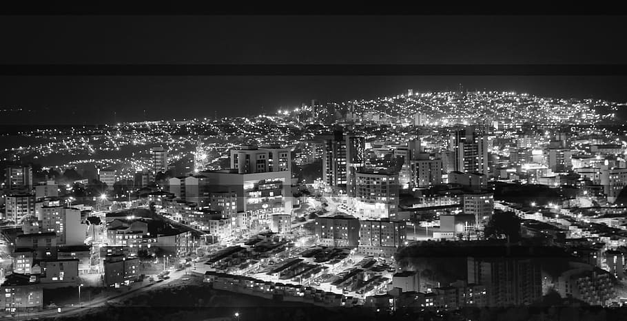 grayscale aerial photography of city skyline during nighttime