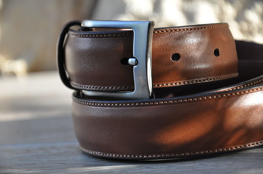 shallow focus photography of brown leather belt, menswear, man