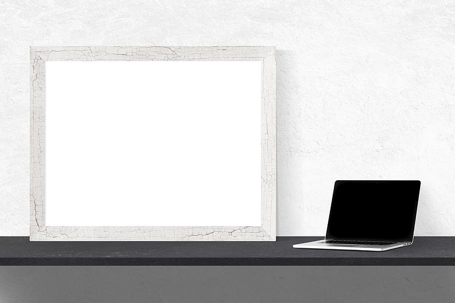 MacBook Pro beside photo frame, mockup, wall, poster, template HD wallpaper