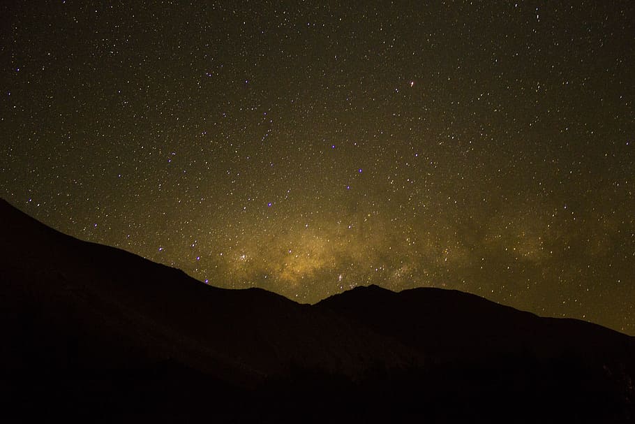 mountain ranges during nighttime, aerial photography of mountain and sky at night time HD wallpaper