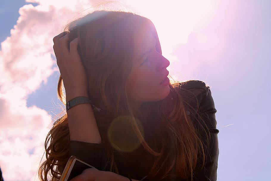 low angle photo of woman in black leather top under blue sky HD wallpaper