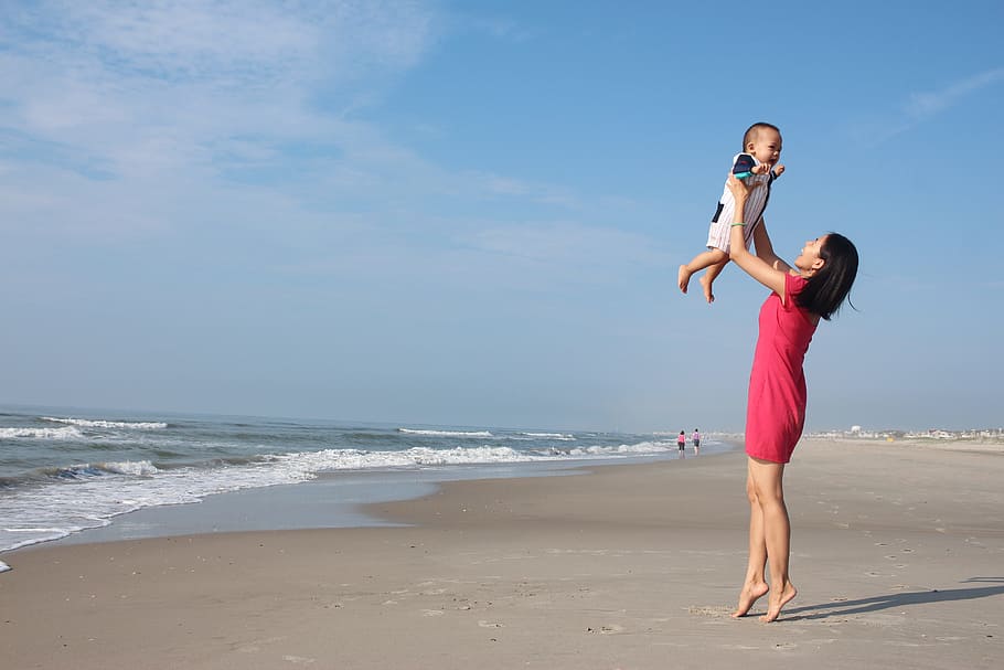 woman raising child near seashore, mother, son, ocean, beach HD wallpaper