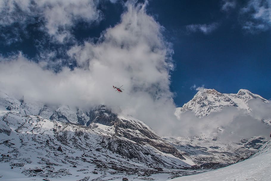 blue sky, red helicopter flying around over snowcap mountain HD wallpaper