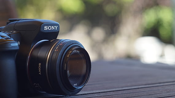 black Sony DSLR camera on brown wooden table, Sony, Alpha, Photo HD wallpaper