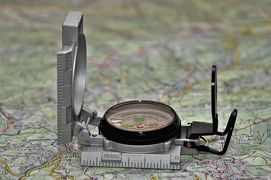 round black and gray analog compass on green map, bearing compass HD wallpaper