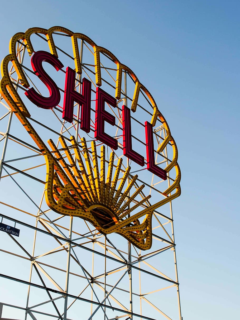 Shell billboard, yellow, red, signage, daytime, gas, company