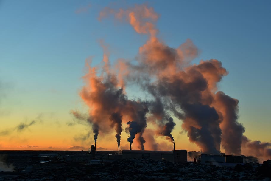 silhouette of factory during sunset, silhouette photo of smoke under blue sky HD wallpaper