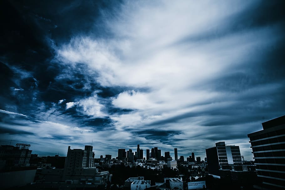 city building under black sky, photography of high rise buildings HD wallpaper