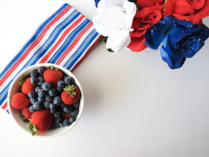blueberries and strawberries in white bowl on white surface HD wallpaper