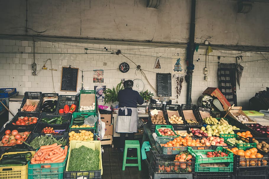 person standing at vegetable and fruitstand, woman standing near vegetables on crates HD wallpaper