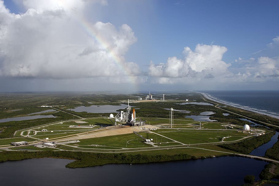 aerial view of green field with building during daytime, launch pad