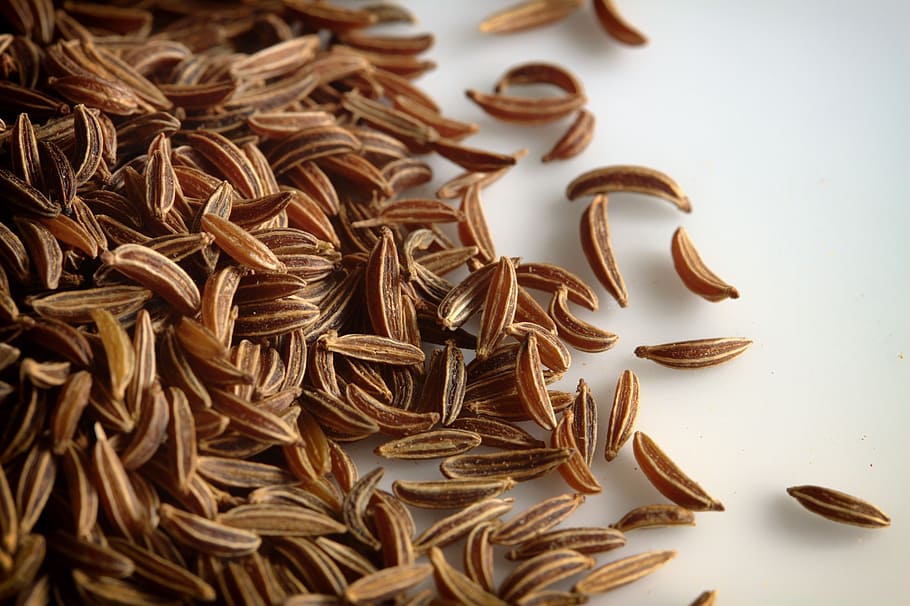 brown nut lot, caraway seeds, macro, close-up, background, food