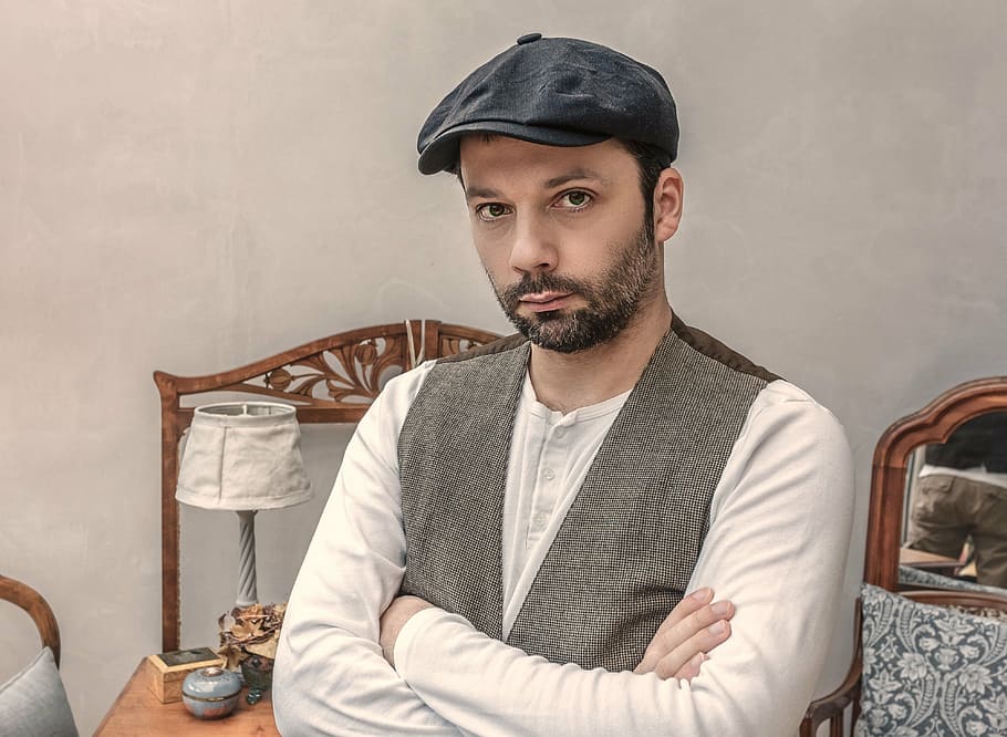 man sitting with crossed arms, folded arms, grumpy, relaxed HD wallpaper