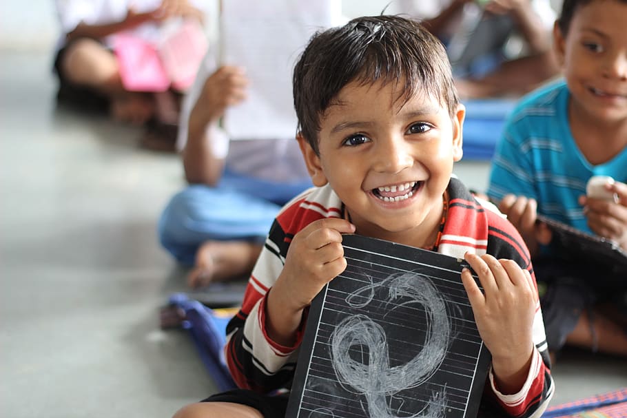 boy holding a black board smiling, school, laughing, children, HD wallpaper