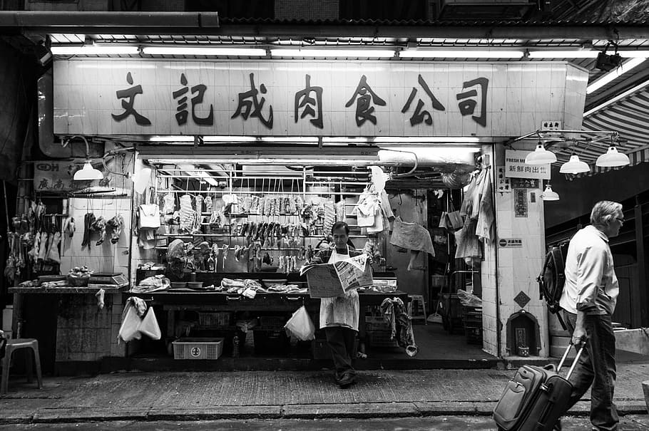 Break time, grayscale photography of man walking with trolley bag on front of store HD wallpaper