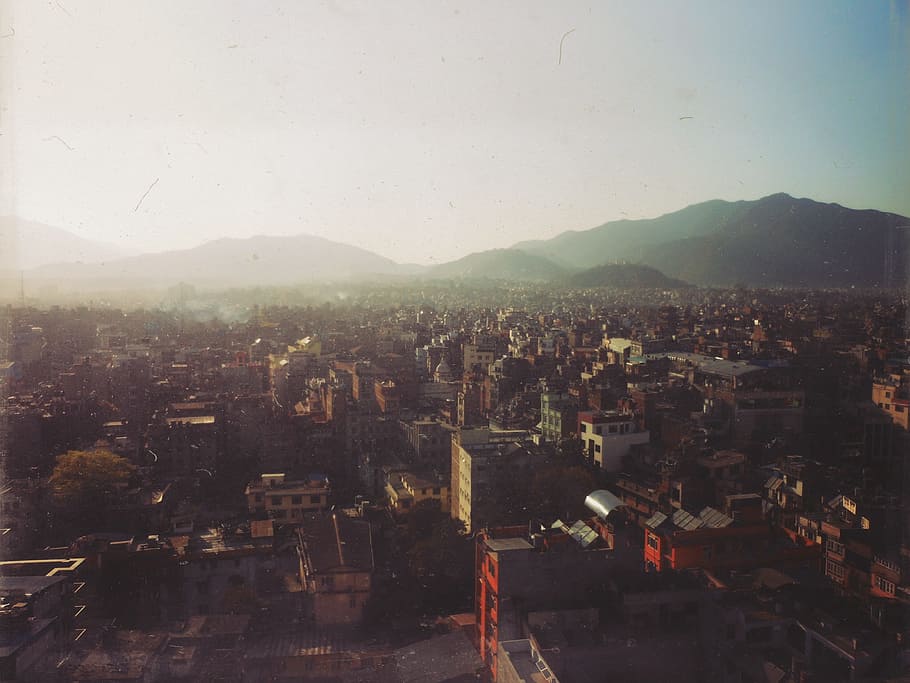 buildings, rooftops, city, architecture, skyline, mountains HD wallpaper