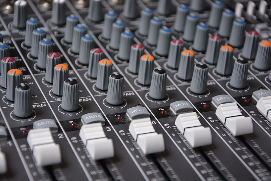 macro shot of gray studio mixer, digital, analog, audio, controller