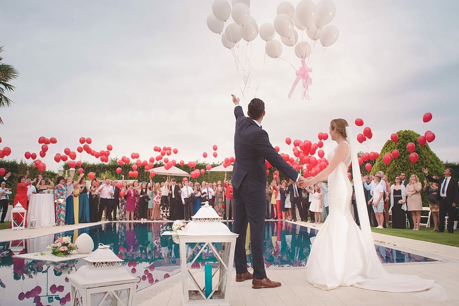 Globos Boda, newlywed couple beside pool under cloudy sky during daytime