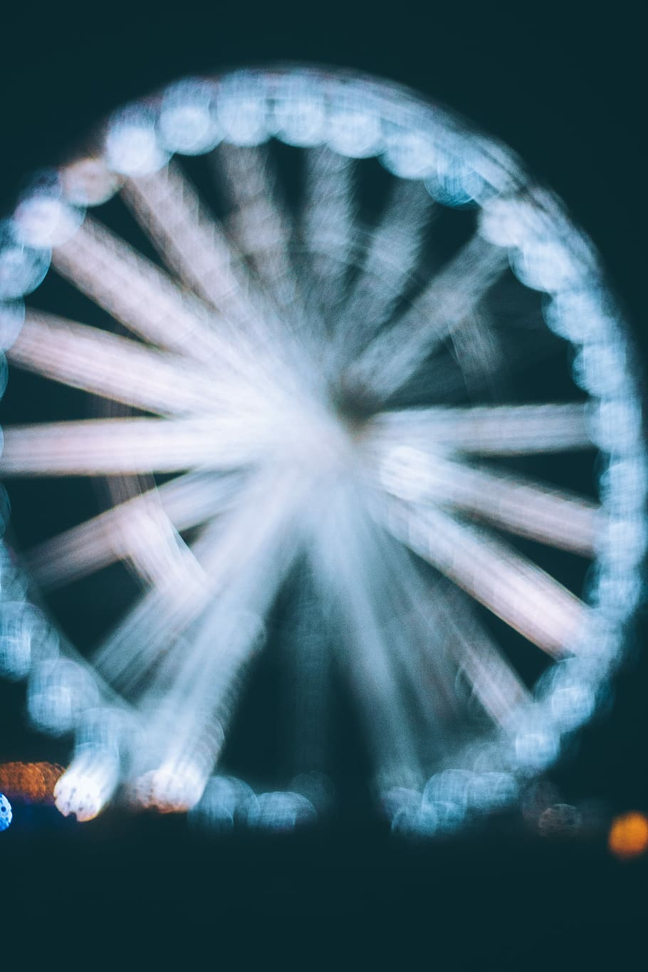 white carousel with LED lights, bokeh, blur, ferris wheel, amusement ride
