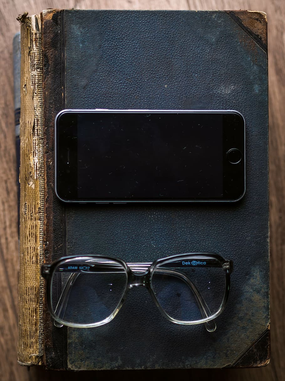 turned off space gray iPhone 6 beside eyeglasses on top of black books on table, HD wallpaper