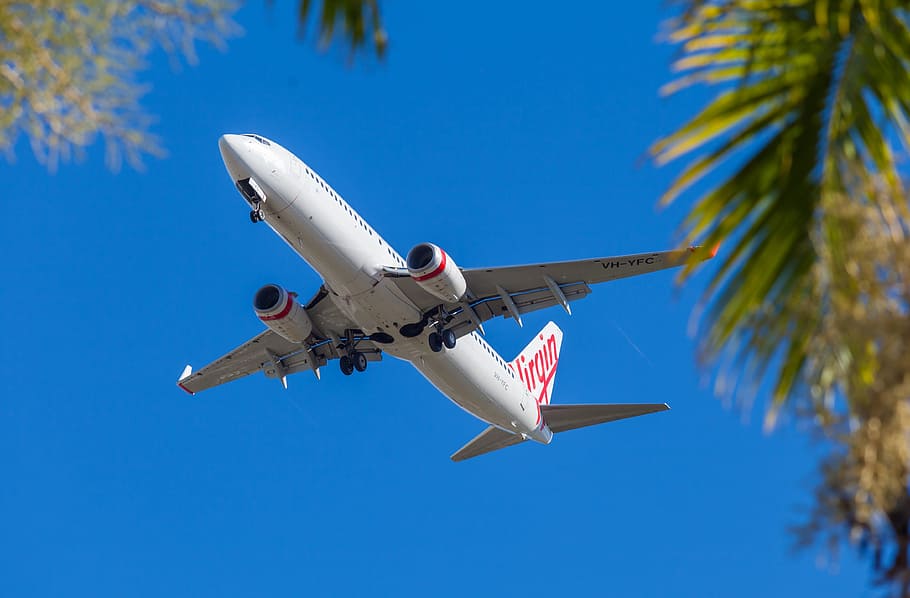 time-lapse photography of Virgin airplane in flight, jet liner