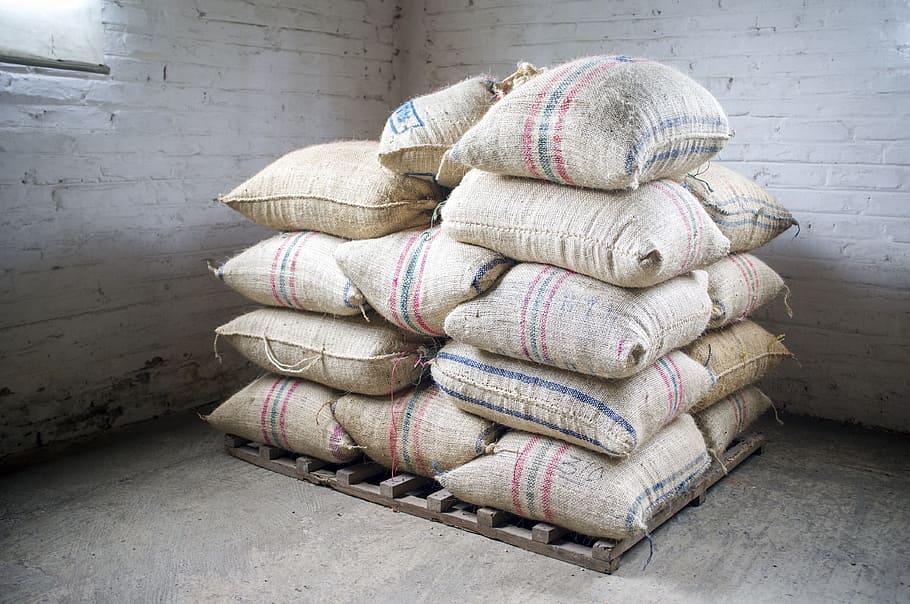 brown-and-blue sack lot, coffee, beans, burlap, colombia, bag