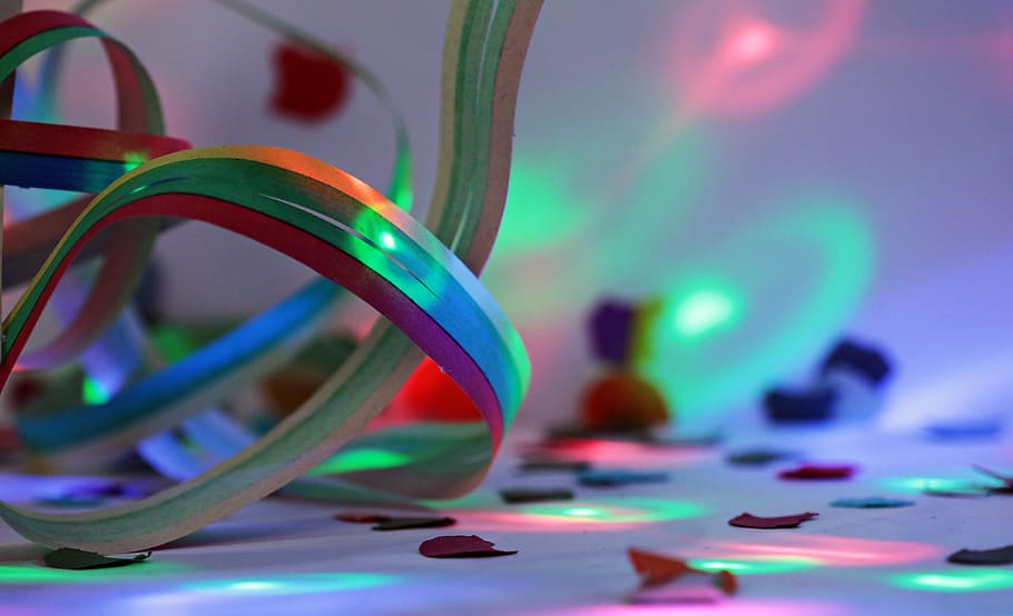 selective photography of multicolored strap, streamer, confetti HD wallpaper