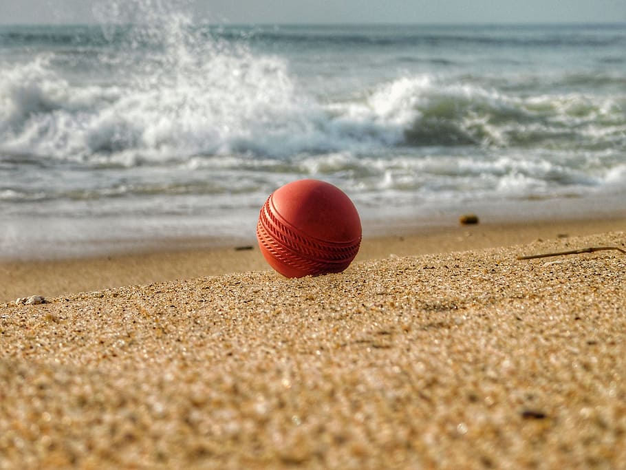 water, ball, cricket, sand, red, beach, land, sport, sea, wave