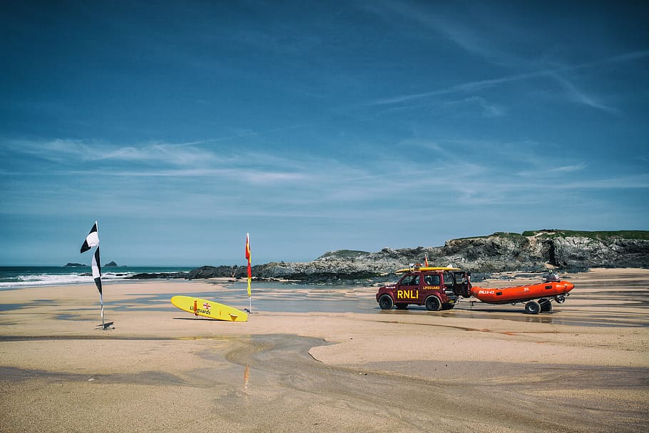 Lifeguard boat and surfboards on a beach in Cornwall in the South-West of England. Image captured with a Canon 5D HD wallpaper