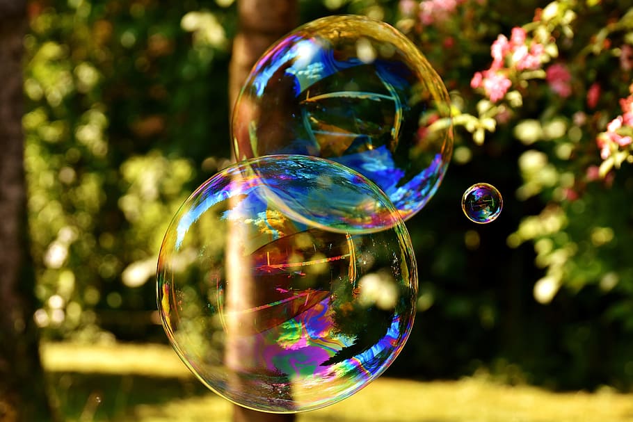 selective focus photography of three bubbles during day time