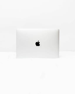 MacBook White open on white surface, silver Apple MacBook on white surface HD wallpaper