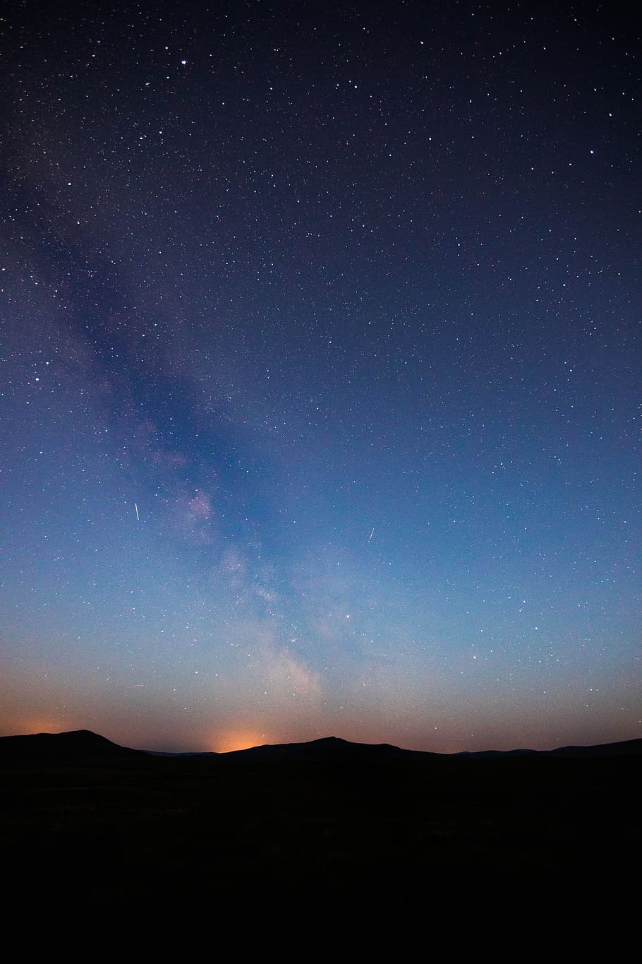 silhouette of mountainous terrain under milky way, starry sky during night time HD wallpaper