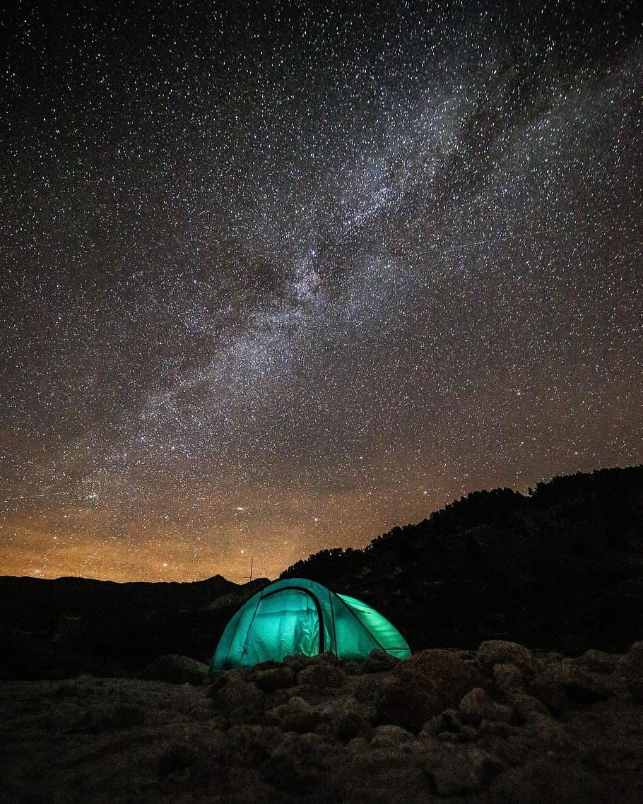 green tent under sky with stars, green tent during nighttime