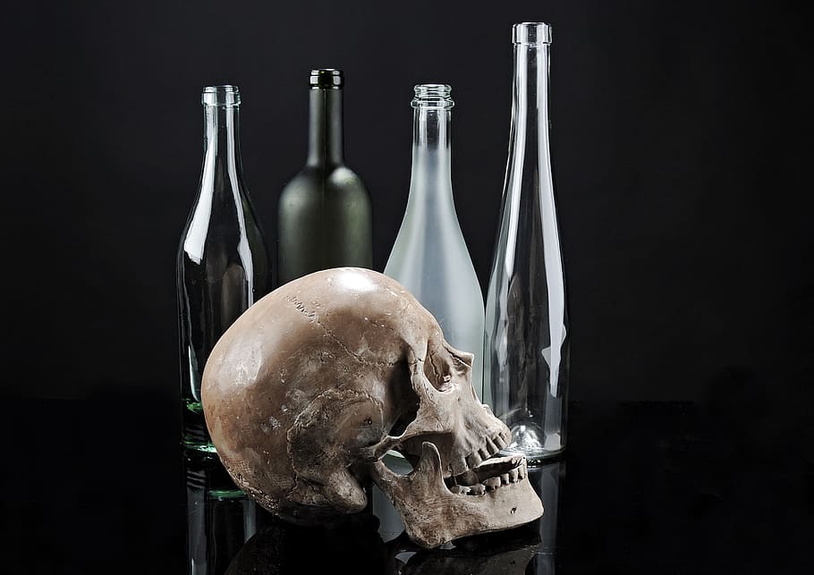 skull beside glass bottles, skeleton, contrast, composition HD wallpaper