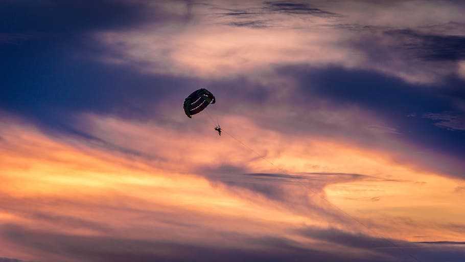 person paragliding in air during day time, person using parachute HD wallpaper