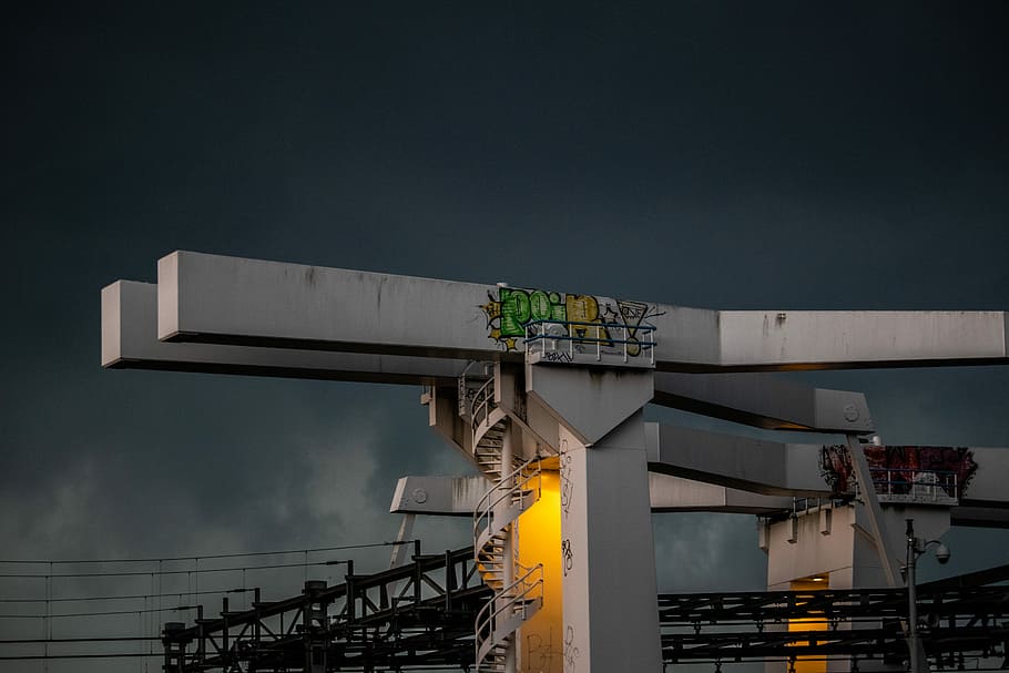 lighted gray tower, spiral stairs on gray building, dark, stormy cloud HD wallpaper