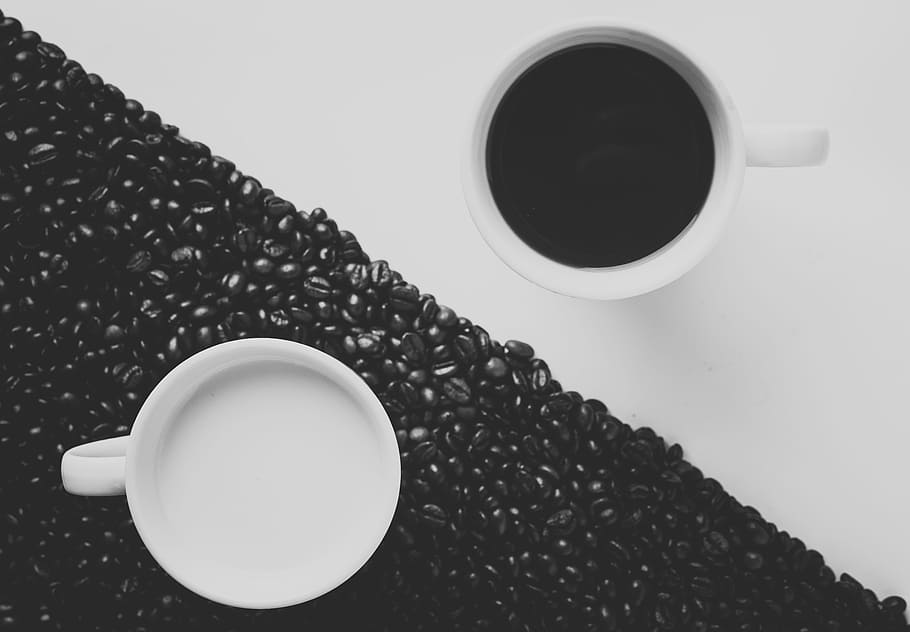 white ceramic coffee mug filled with black liquid, two white ceramic mugs with coffee