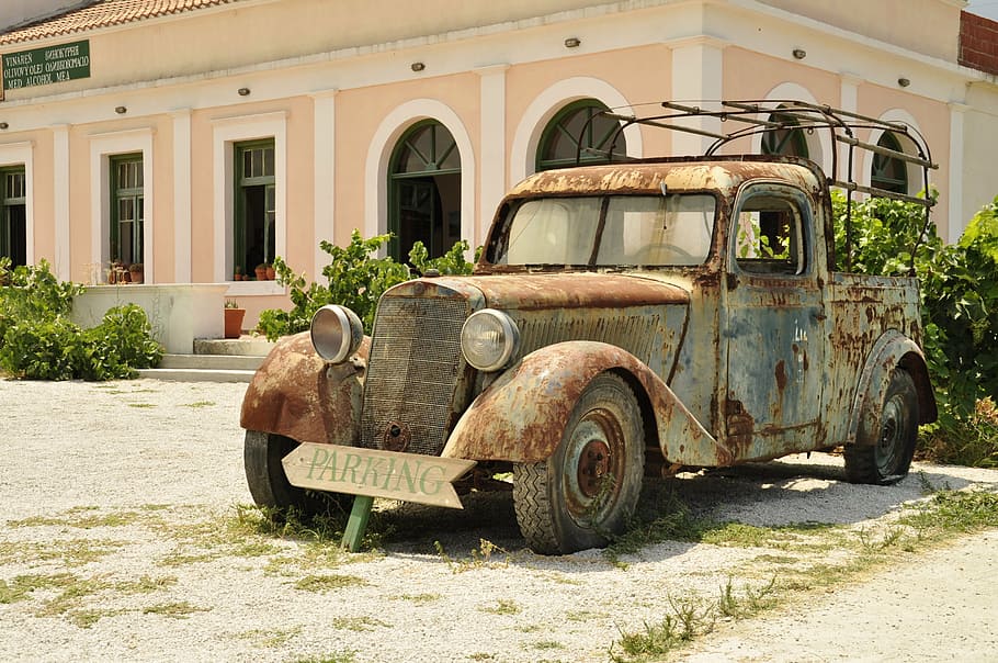 rustic single-cab pickup truck near beige and white painted house taken during daytime HD wallpaper