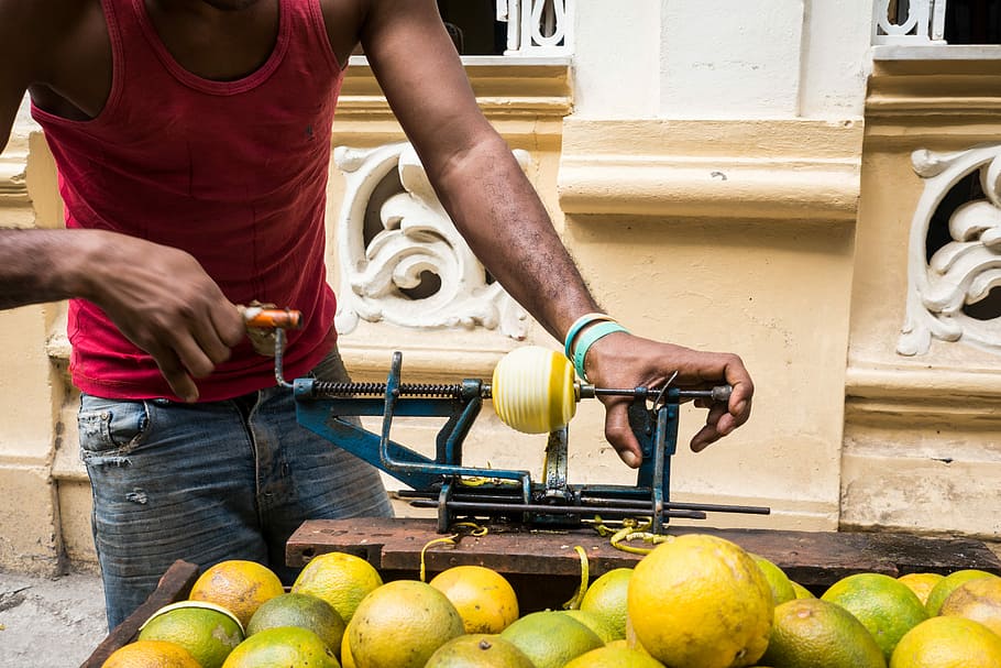 Peeling yellow oranges the Cuban way, fruit, hands, outside, process HD wallpaper