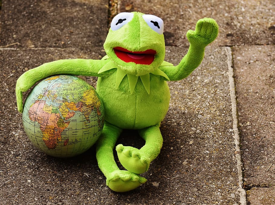 Kemitt the frog with globe sitting on surface, kermit, holiday greetings