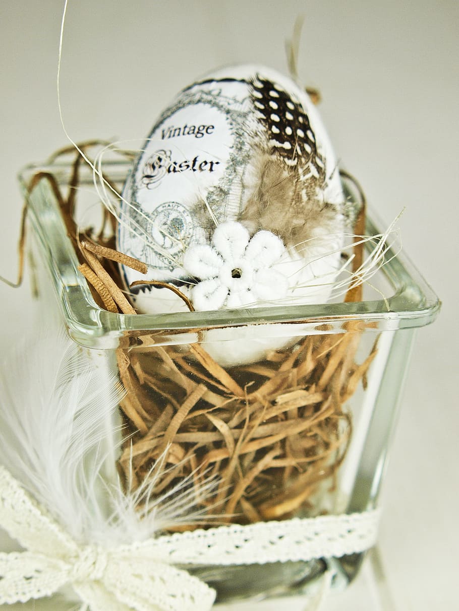 white and brown easter egg on rectangular clear glass container HD wallpaper