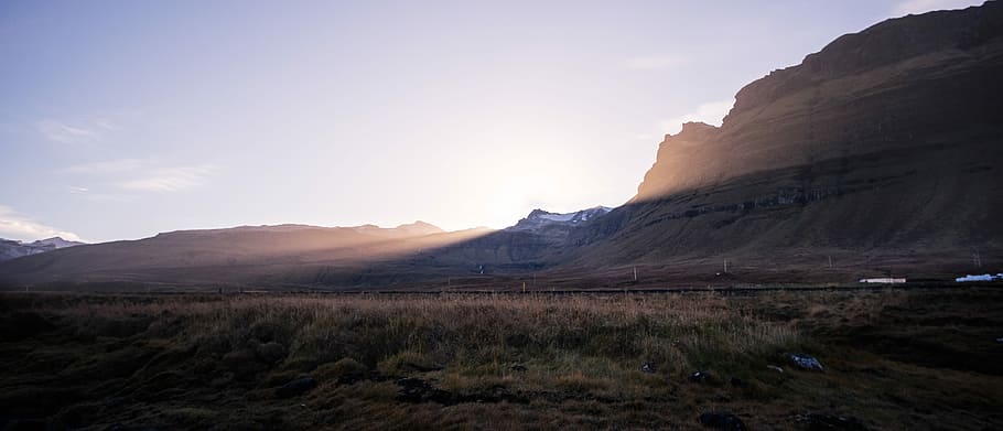 mountain silhouette during golden hour, sunrise behind the mountain HD wallpaper