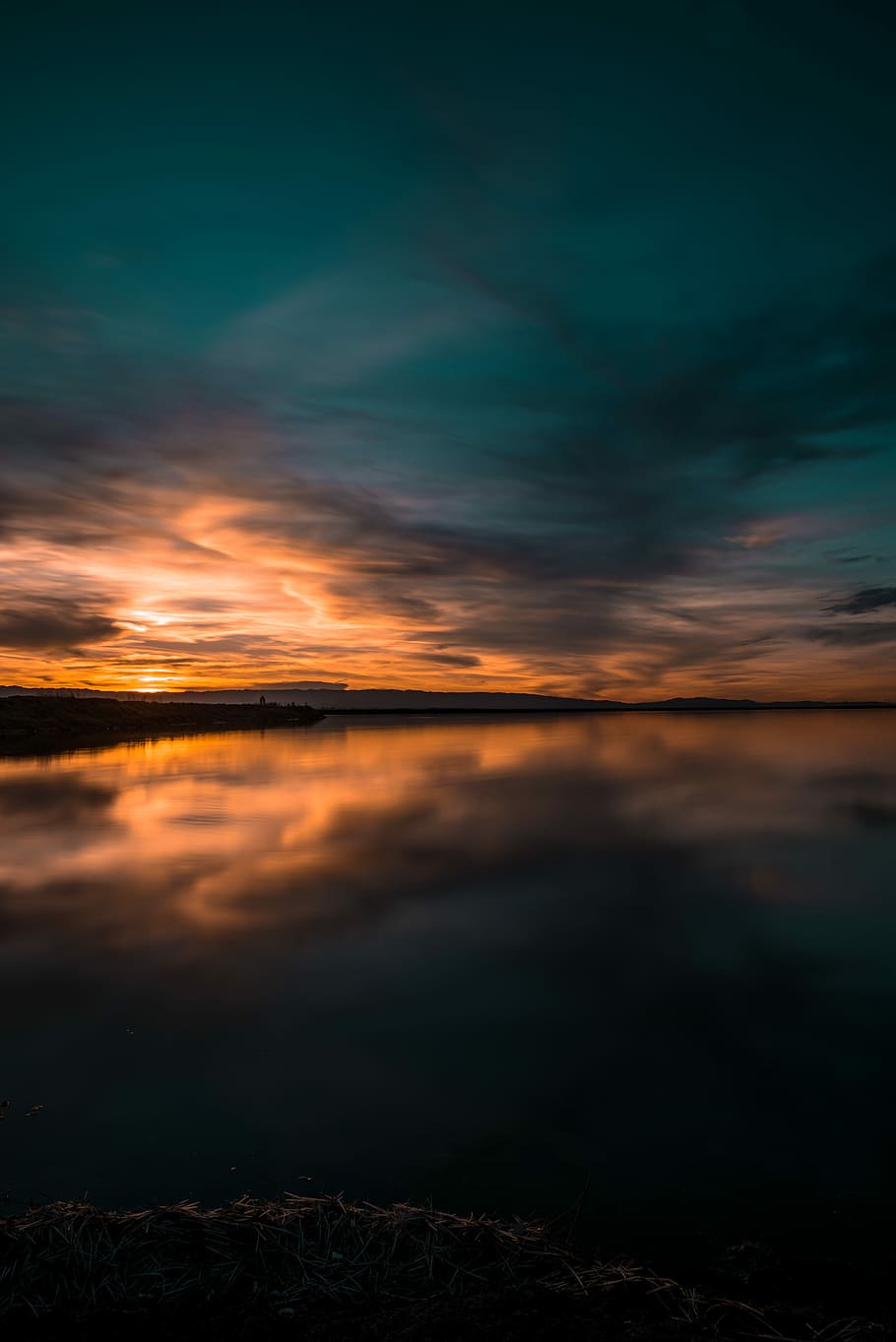 body of water under green sky, body of water under blue and orange sky during twilight HD wallpaper