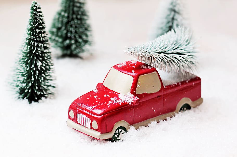 red single cab pickup truck die-cast model, christmas tree, christmas motif