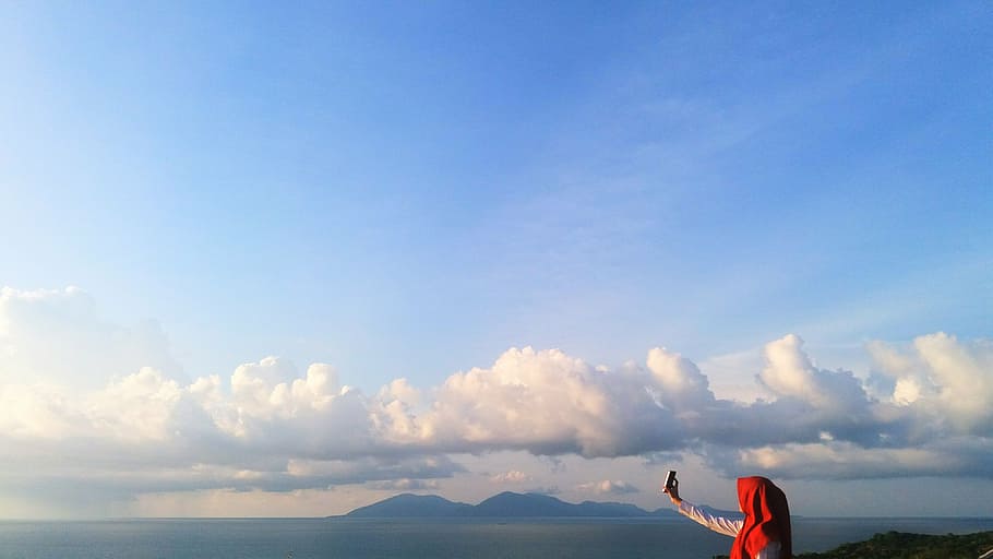 person taking selfie under white clouds, happy, sky, cloud - sky HD wallpaper