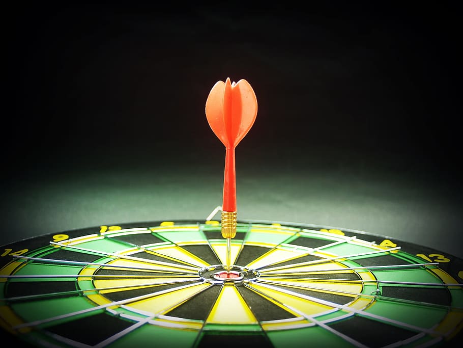 orange arrow on dartboard closeup photo, target, goal, aiming