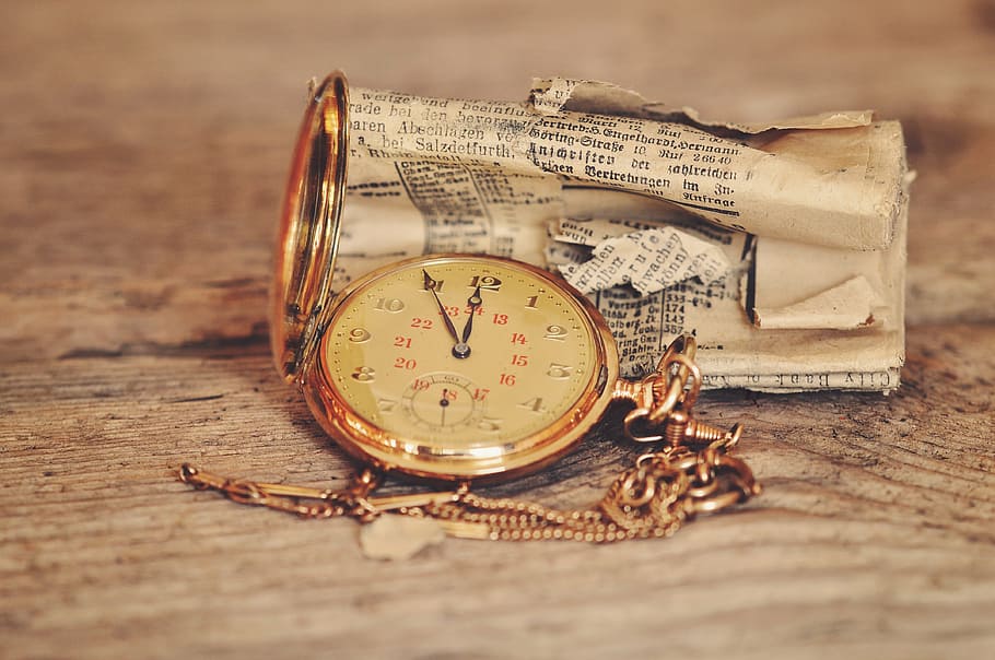 round gold-colored analog pocket watch at 11:55, clock, clock face
